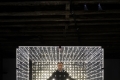 Vittorio Corsini all'interno dell'opera Esercizio 2, 2023, plexiglas e led, cm 200x200x200. Ph. Silvio Salvador