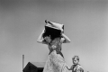 Robert Capa, Woman carrying luggage accompanied by a small boy, Haifa, ISRAEL, 1949-50 @ Magnum Photos